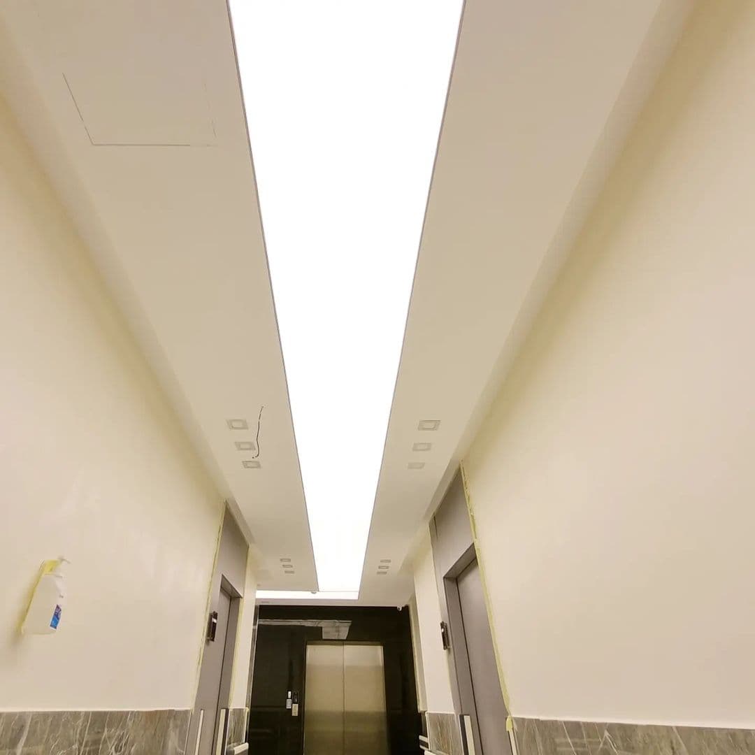 Corridor with a single continuous backlit light line