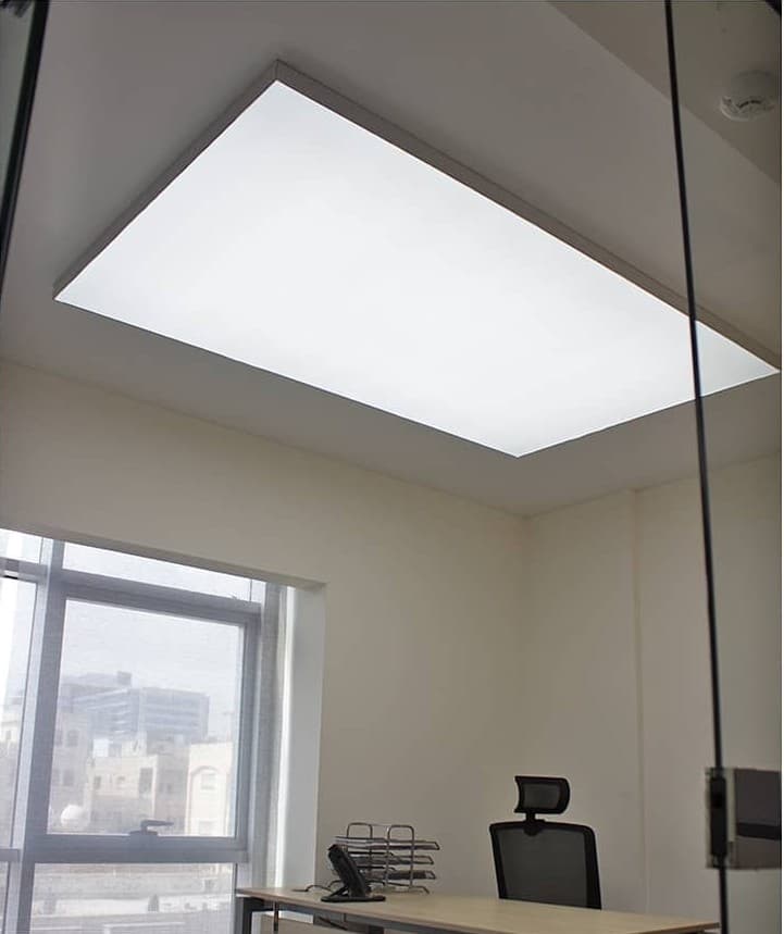 Office cabin with a rectangular backlit stretch ceiling panel
