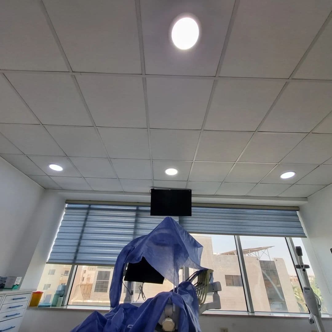 Wide view of a clinic room with a printed sky panel