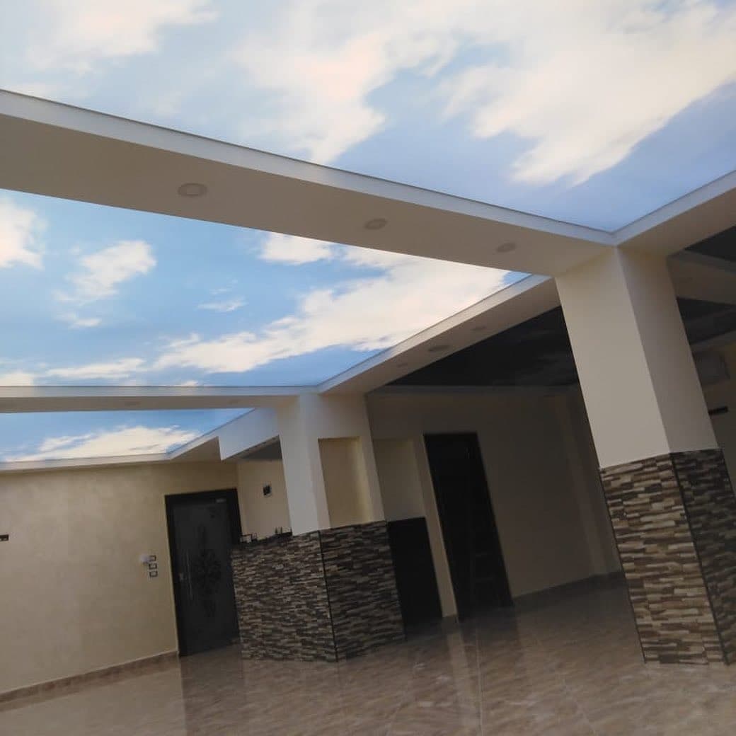 Building lobby with printed sky stretch ceilings